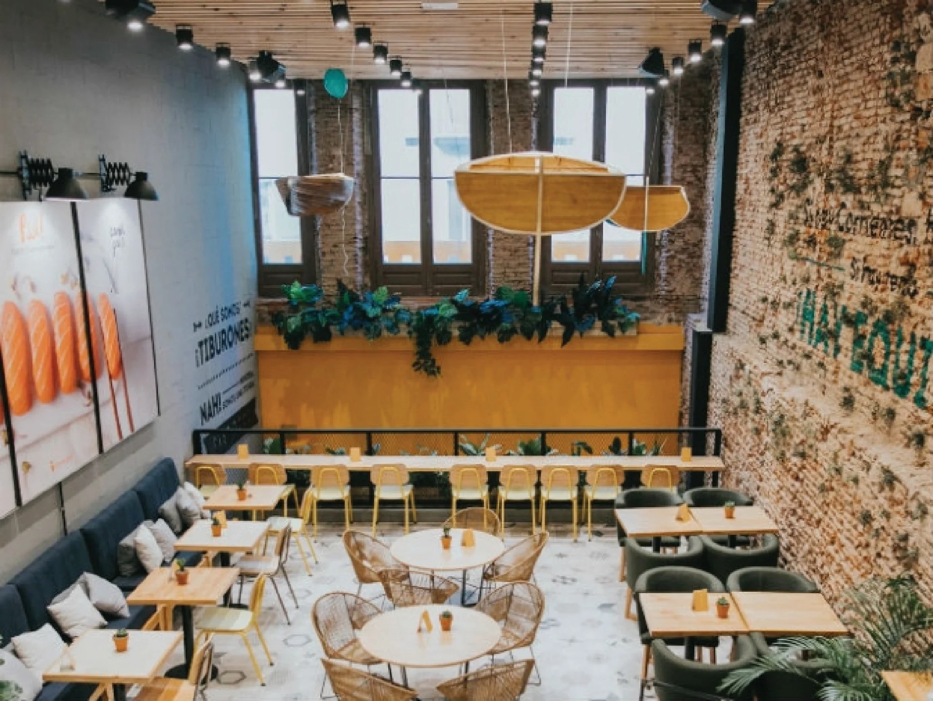 Green Eat overhead view, rattan pendants, mixed seating zones, botanical elements